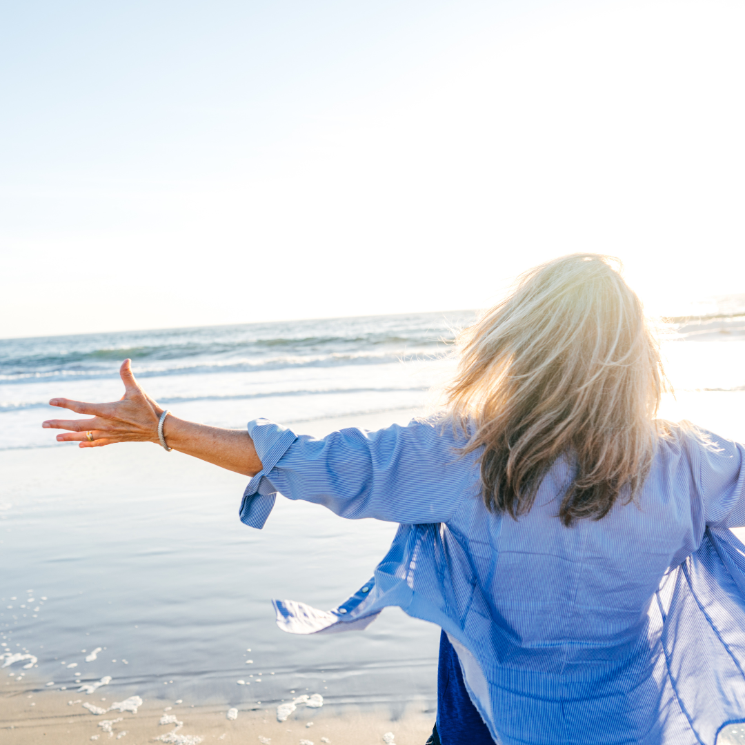 Woman smiling outdoors, embodying positivity and resilience